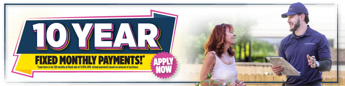 Banner showing "10 YEAR FIXED MONTHLY PAYMENTS* APPLY NOW" and a worker discussing basement waterproofing with a smiling woman outdoors.