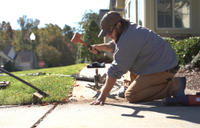CFI installing poly to level concrete sidewalk