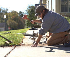 CFI installing poly to level concrete sidewalk