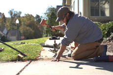 CFI installing poly to level concrete sidewalk