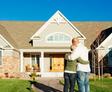 homeowners looking at their home's exterior