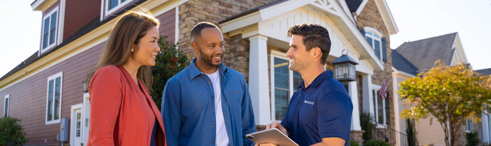 Baker's Waterproofing CFI with customers in front of home