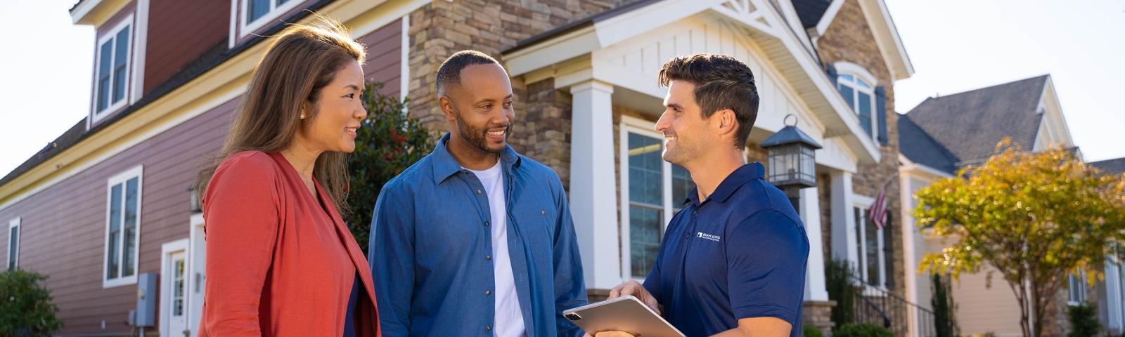 Baker's Waterproofing CFI with customers in front of home