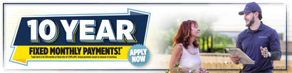 Banner ad: "10 Year Fixed Monthly Payments* Apply Now." A woman smiles at a man holding a clipboard outdoors.