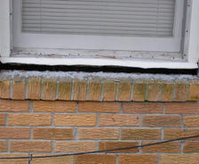 A window sill cracking and separating from the foundation wall in a Opelika home.