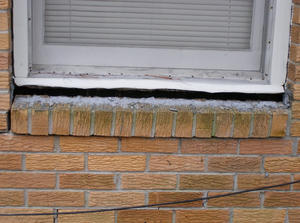 A window sill cracking and separating from the foundation wall in a Opelika home.
