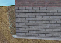 Hydrostatic pressure from fill soils expanding around basement walls