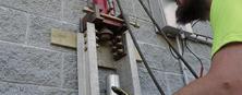 man installing wall piers