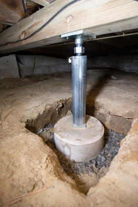 Installed IntelliJack in crawl space detail of footing portrait