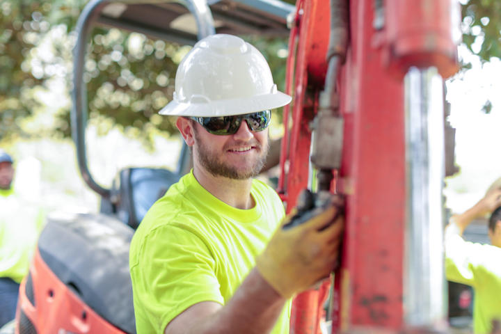 AFS crew member smiling at job site.