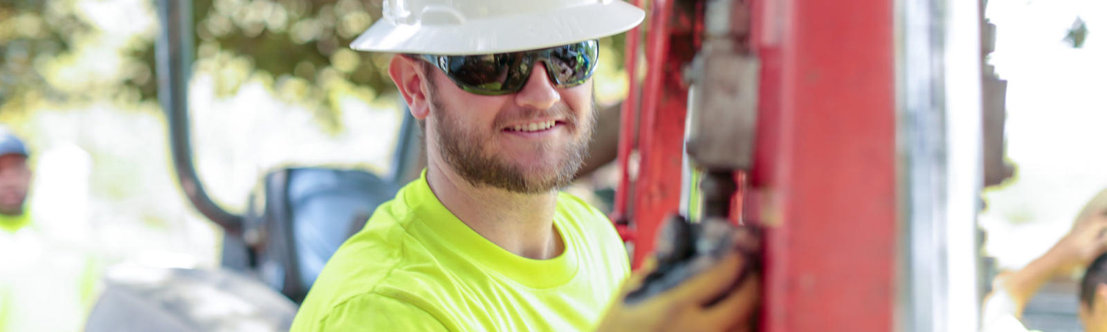 AFS crew member smiling at job site.