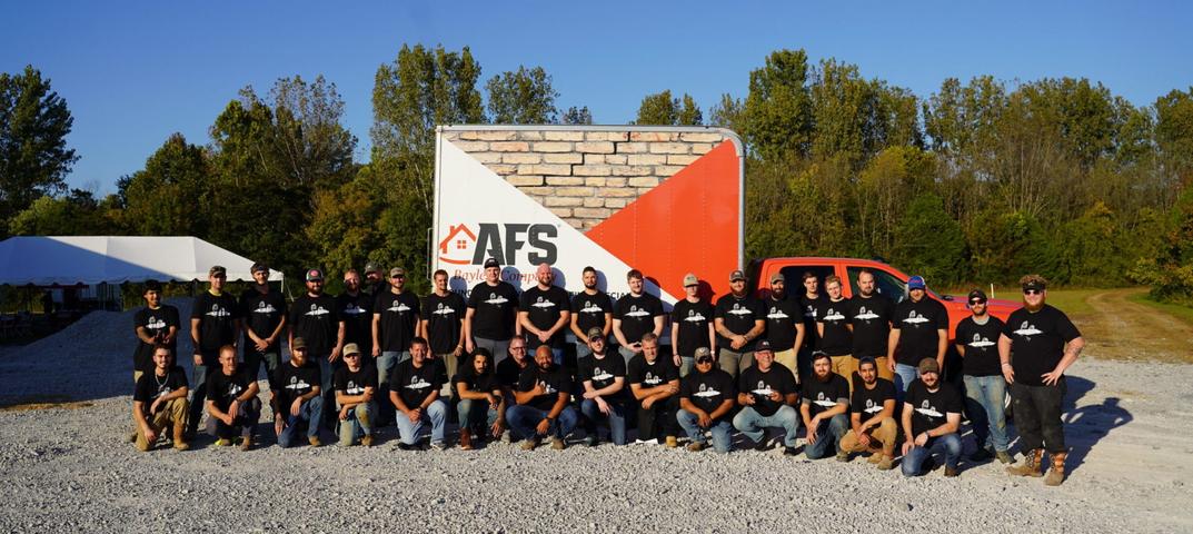 AFS employees in front of truck