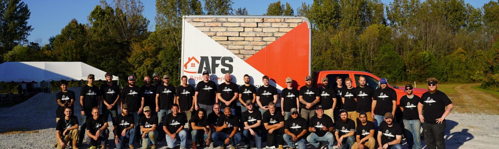 AFS employees in front of truck