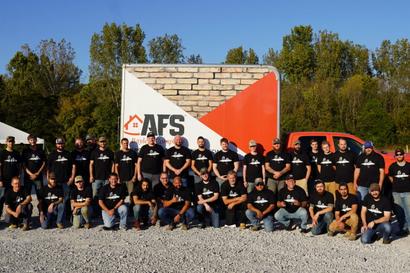 AFS employees in front of truck