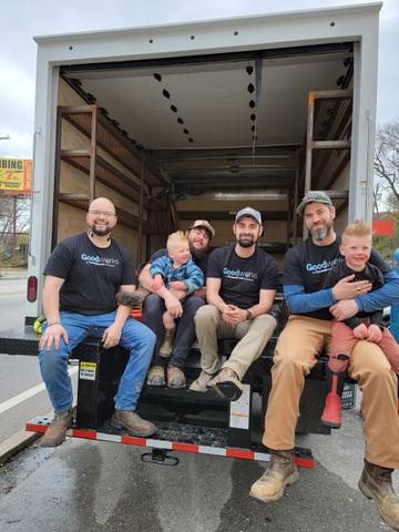 AFS crew members and family smiling while sitting in AFS truck.