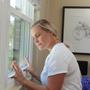 woman trying to open sticking window