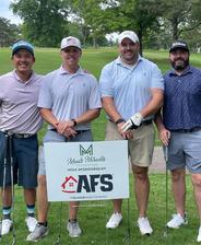 AFS teammates participating in the annual Meads Miracles Golf Tournament