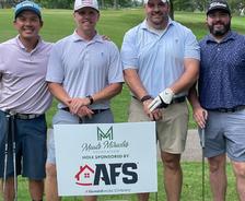 AFS teammates participating in the annual Meads Miracles Golf Tournament