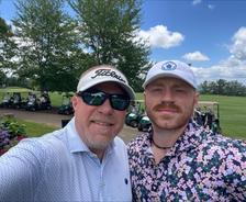 AFS team member Benjamin Worsham and his son at the Swing Fore Children with Cancer Golf Tournament