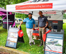 AFS crew under branded tent at Lexington Humane Society Mutt Strut sponsorship event