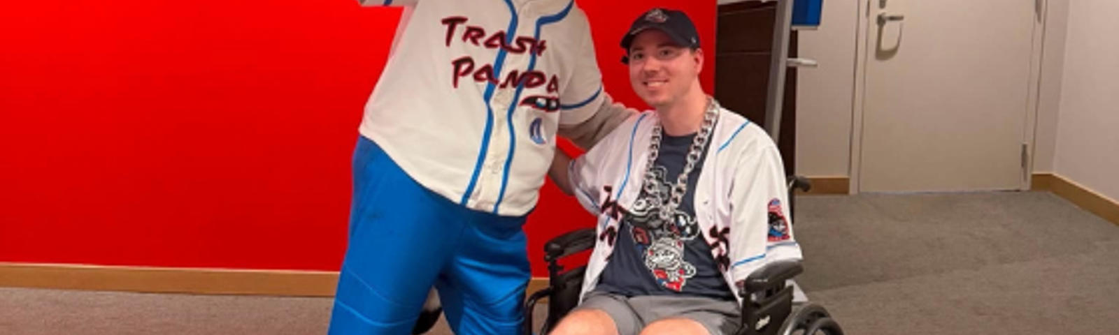 AFS team members son and the mascot for Dinosaur Weekend at Toyota Field during the Rocket City Trash Pandas game