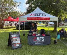 AFS team at sponsorship booth at Peach Jam Jubilee in Clanton