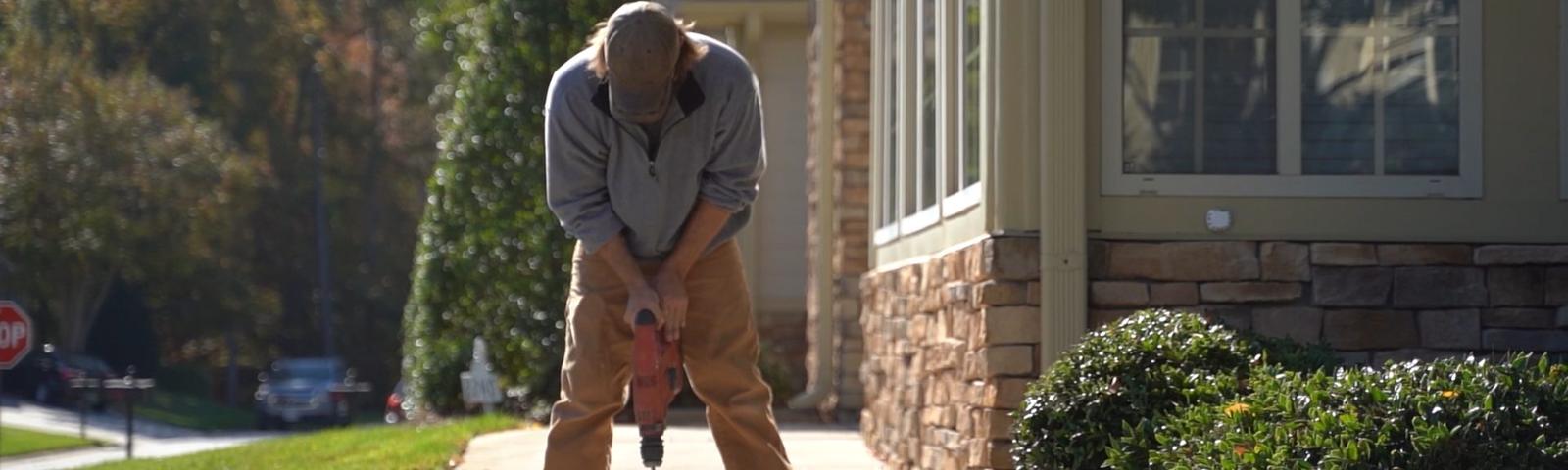 CFI drilling through concrete sidewalk.