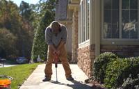 CFI drilling through concrete sidewalk.