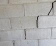 Stair-step settlement crack in basement wall