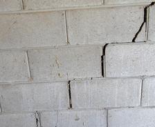 Stair-step settlement crack in basement wall