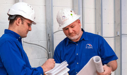 FSM crew members interacting at job site