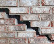 closeup of stairstep crack on exterior bricks
