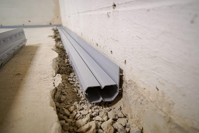 Installed basement gutter french drain