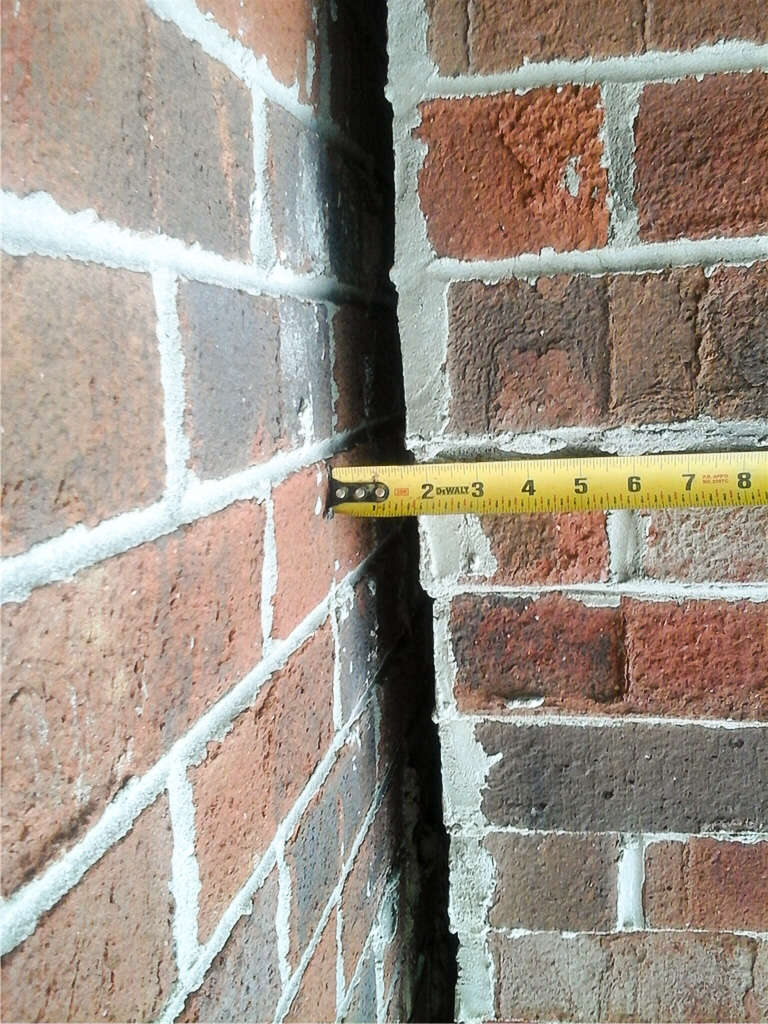 tape measure on gap in brick