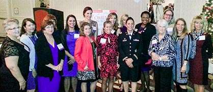 Stella Waltz posing with women at the 2015 Women In Business Achievement Awards dinner.