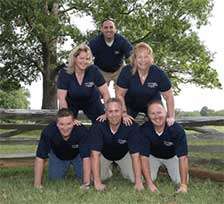 JES employees posing in pyramid formation.