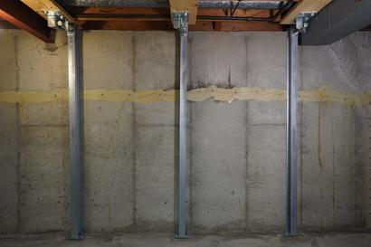 IntelliBrace wall repair system installed on a cracked basement wall.