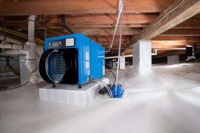 Dehumidifier in an encapsulated crawl space.