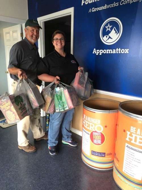 JES employees standing in front of food bank truck.
