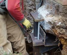 JES Foundation Repair crew installing foundation pier