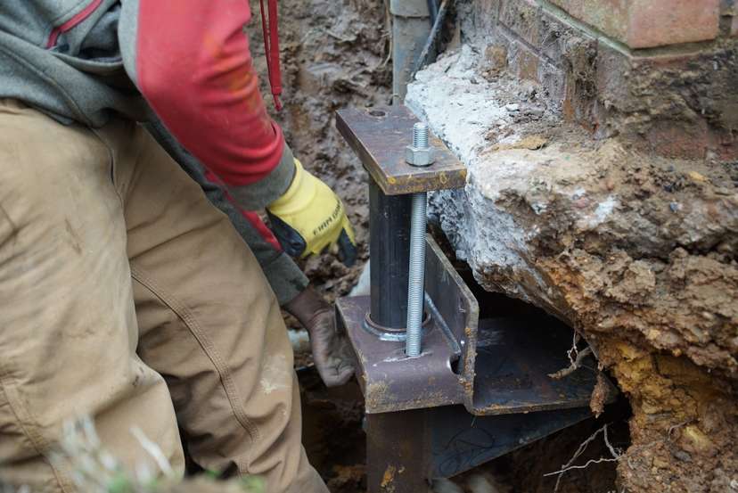 JES Foundation Repair crew installing foundation pier