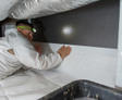 Crew installing Crawl Space Barrier