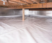 A well-maintained, sealed crawl space features plastic sheeting on the floor and reflective insulation on the walls. The choice between a 10 mil vs 15 mil vapor barrier ensures optimal protection against moisture, with tailored durability for your specific needs.
