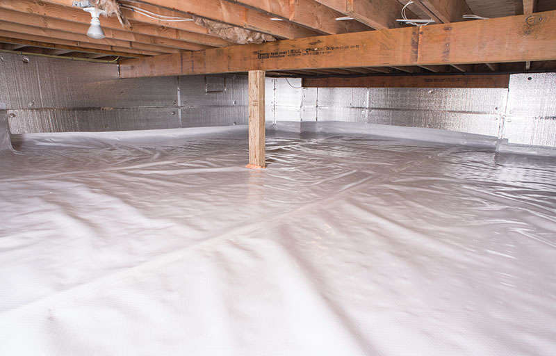 A well-maintained, sealed crawl space features plastic sheeting on the floor and reflective insulation on the walls. The choice between a 10 mil vs 15 mil vapor barrier ensures optimal protection against moisture, with tailored durability for your specific needs.