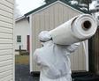 Crew carrying vapor barrier for installation