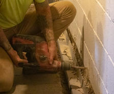Weep holes drilled into the basement wall.