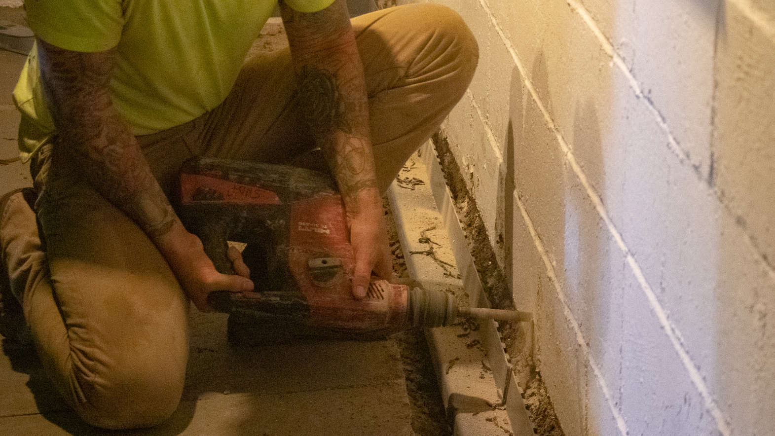 Weep holes drilled into the basement wall.