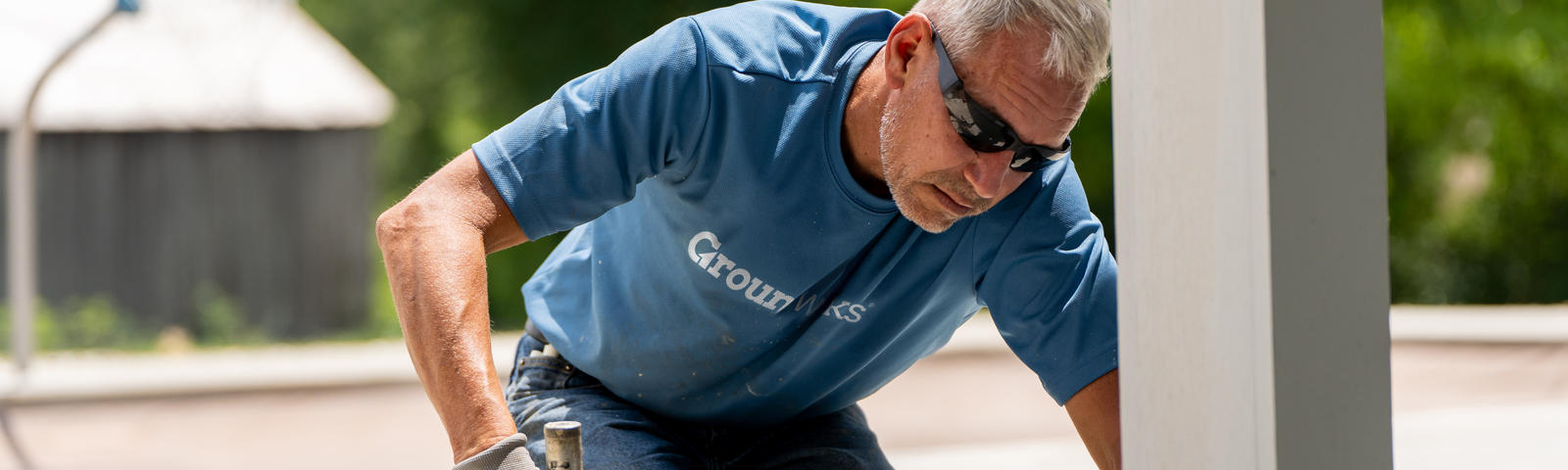 crew member installing polyurethane foam for concrete lifting
