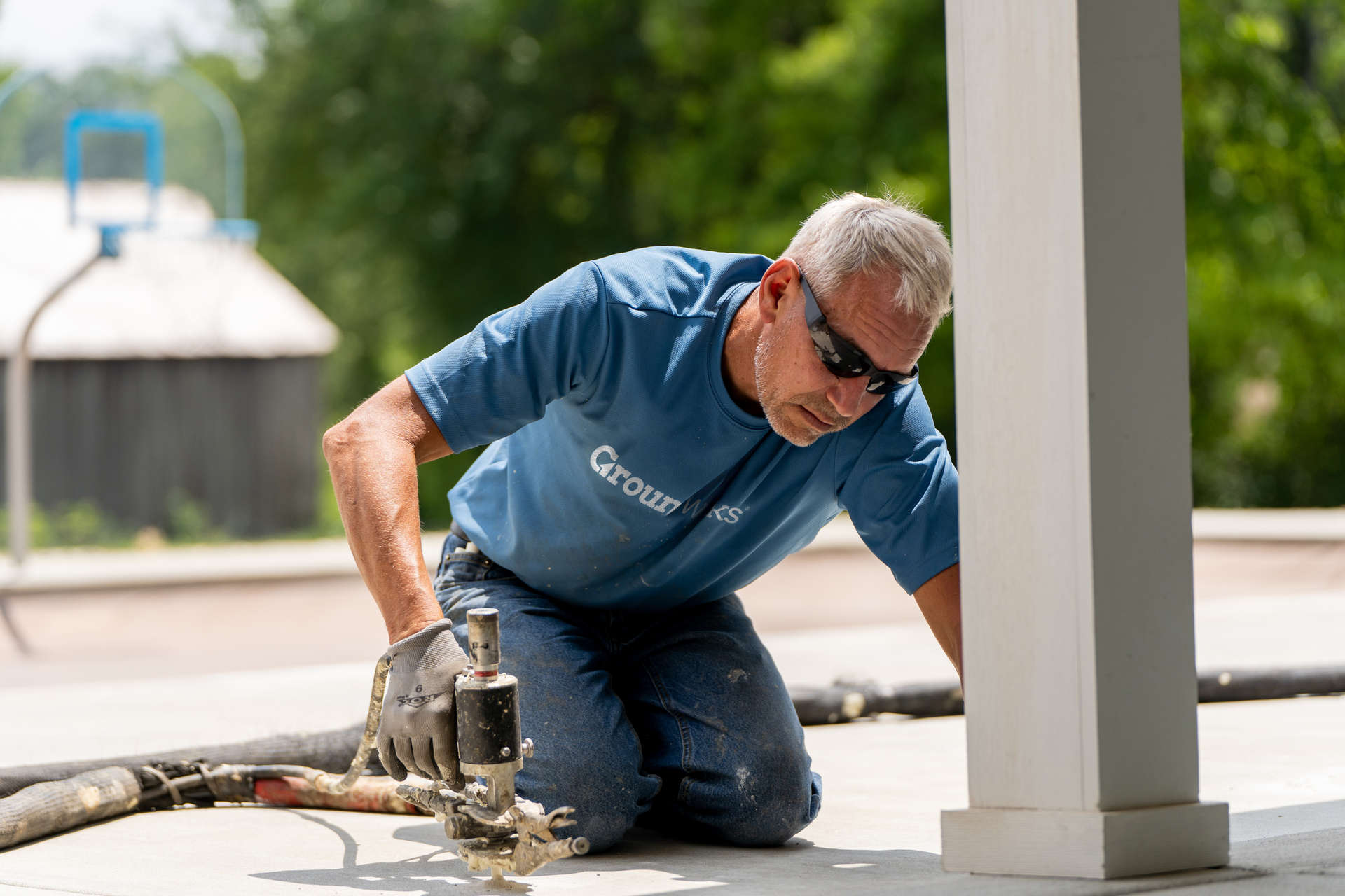 crew member installing polyurethane foam for concrete lifting