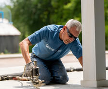 crew member installing polyurethane foam for concrete lifting